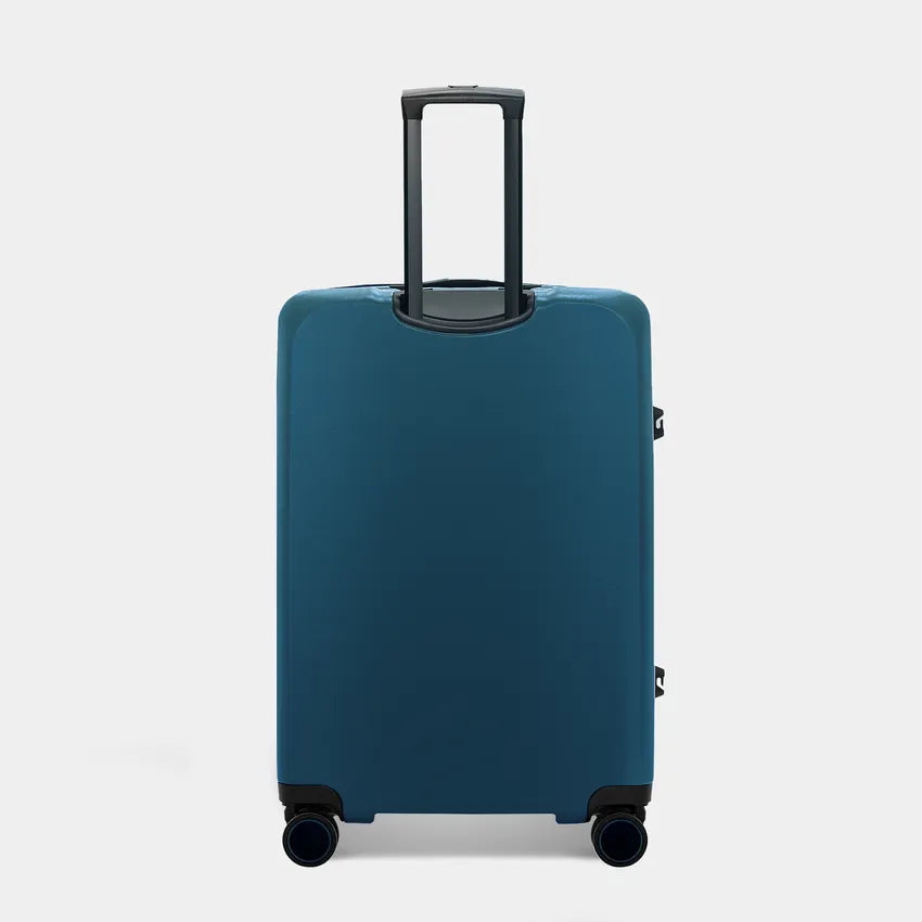 A teal suitcase with a retractable handle stands upright, showcasing its sleek design. It features double wheels for easy maneuverability and a minimalist aesthetic without visible zippers or pockets.