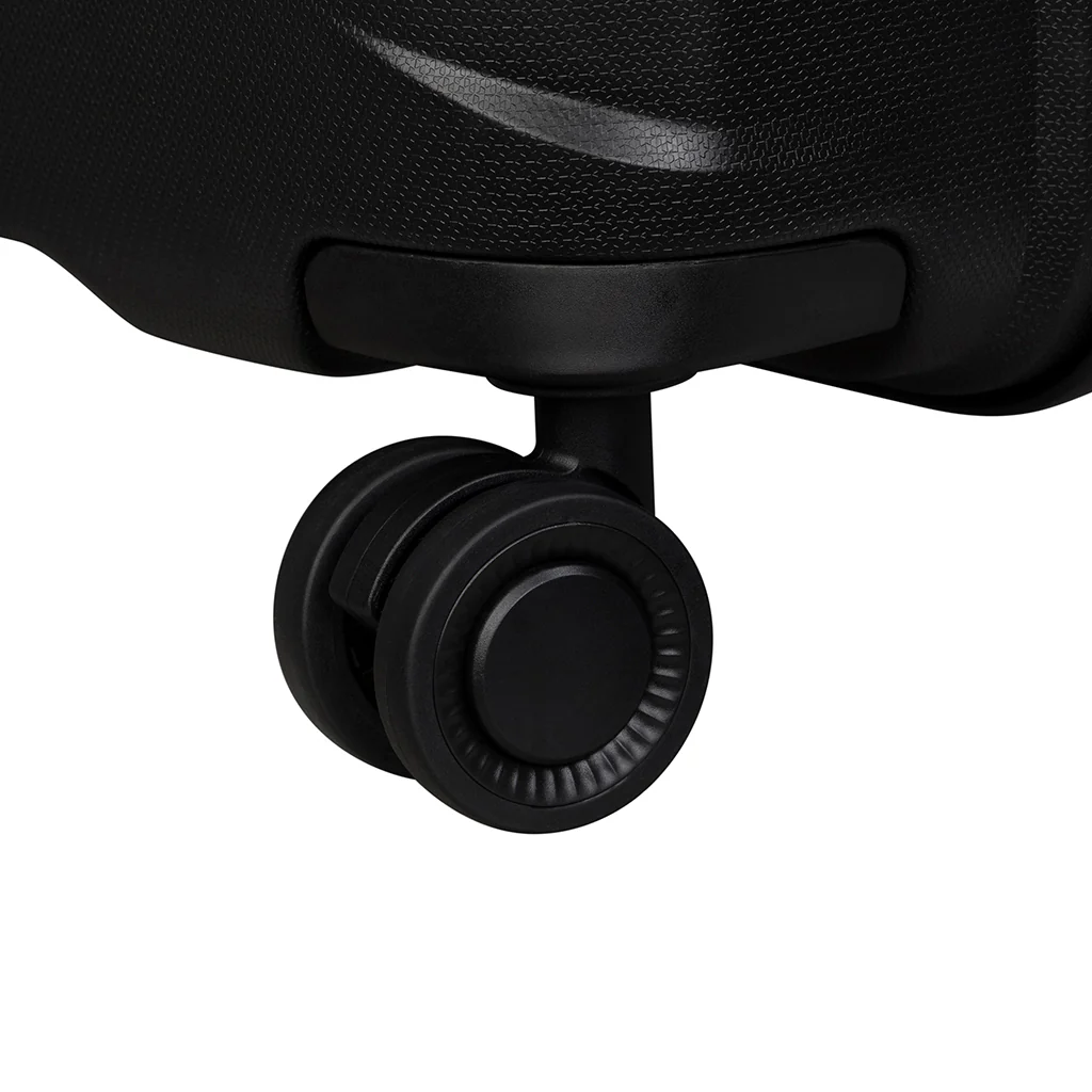 Close-up view of a black spinner wheel from a suitcase, showcasing its smooth, rounded design and sturdy construction. The wheel is positioned at the bottom of the luggage, indicating ease of movement for travel.