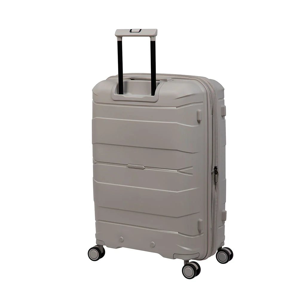 A light gray hard-shell suitcase with a textured surface and a telescoping handle stands on four spinner wheels. The suitcase features a zippered closure and a sleek, modern design, ideal for stylish travel.